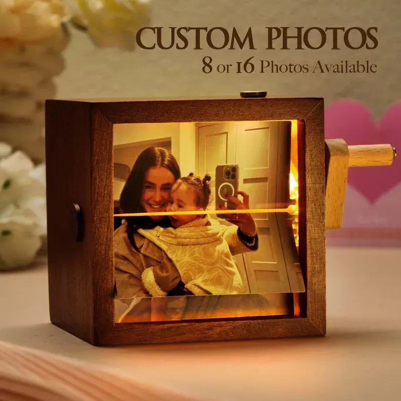 Primary — the lit walnut frame with photos mid-flip